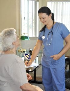 A vein specialist talking to a patient about her restless leg syndrome