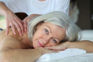 A woman receiving a massage for restless leg syndrome