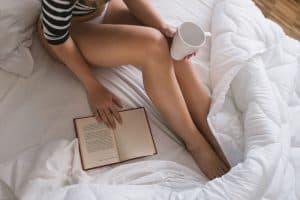 A woman resting comfortably after treatment for restless legs